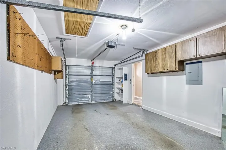Garage featuring electric panel