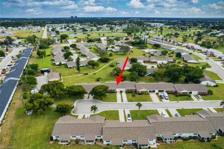 View of property location featuring nearby suburban area and a nearby body of water