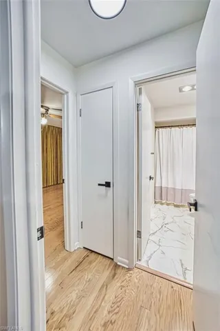 Hall featuring light wood-style floors
