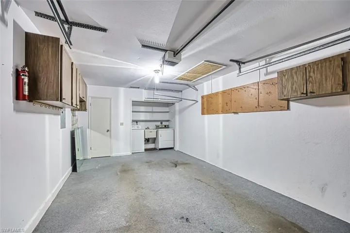 Garage featuring a garage door opener