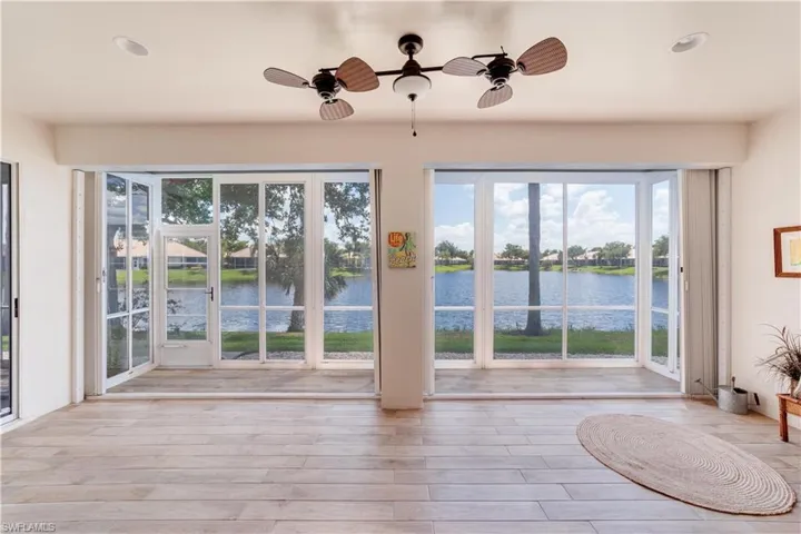 Spacious Covered Lanai with spectacular Lake View (note retractable locking storm shutters).