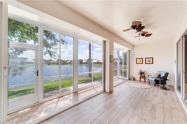 Covered Lanai with acrylic sliders, porcelain tile, and stunning Lake View,