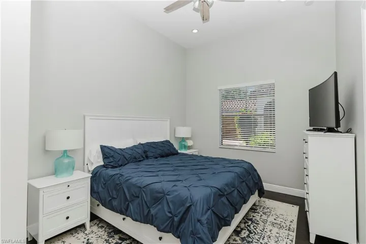 Bedroom featuring dark wood finished floors, recessed lighting, and a ceiling fan