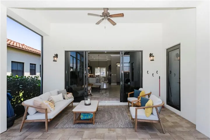 View of patio featuring a ceiling fan and outdoor lounge area