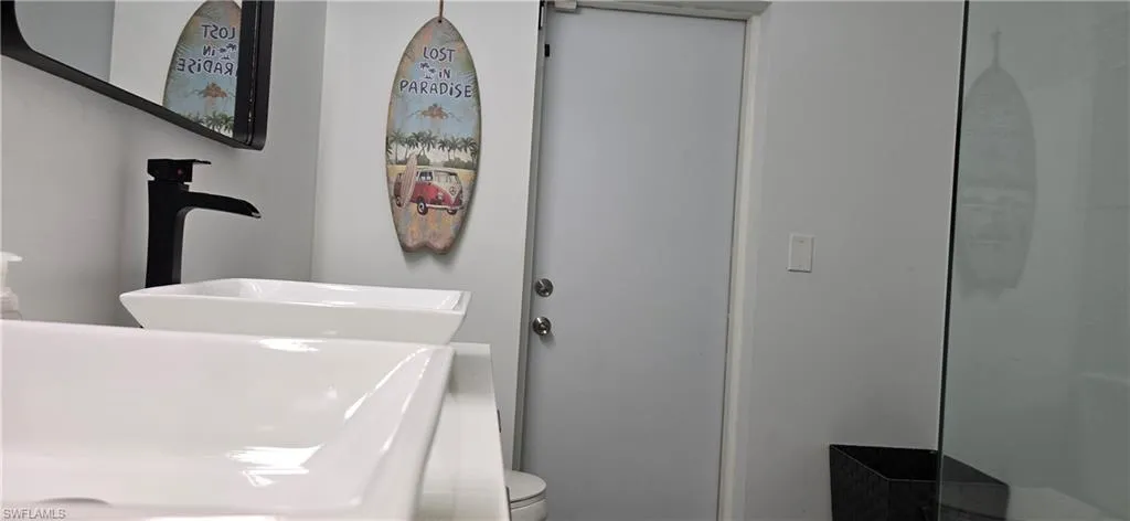 Full bathroom featuring a sink and toilet