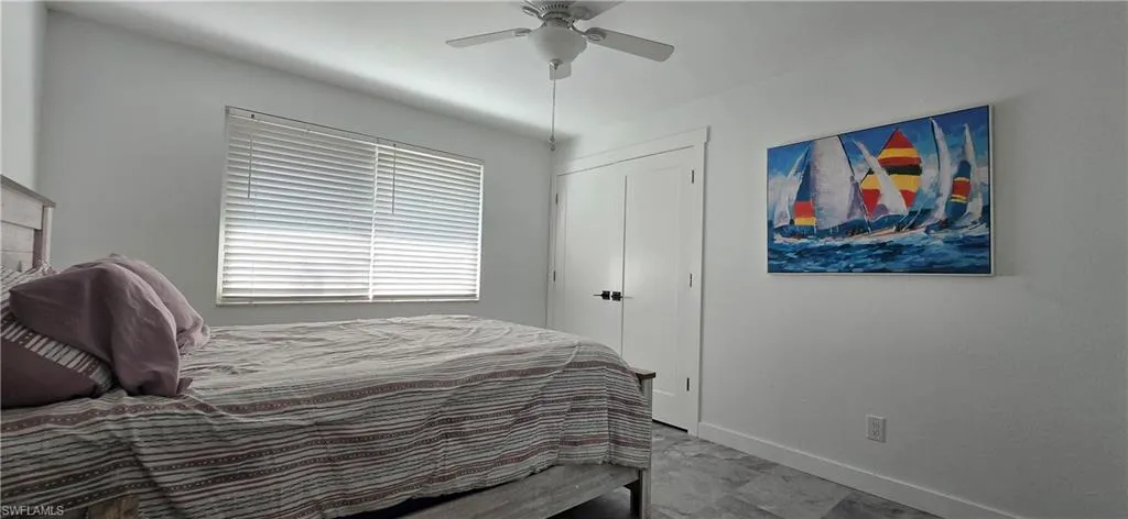 Bedroom with baseboards and ceiling fan