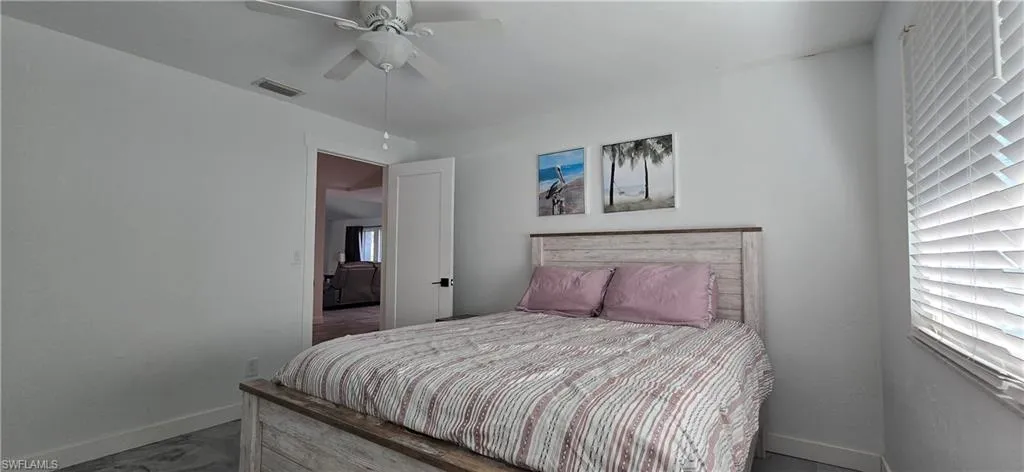 Bedroom featuring baseboards and a ceiling fan