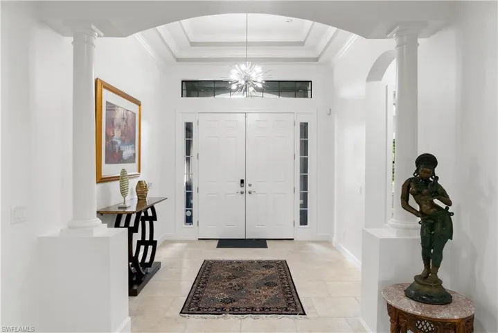 Double entry doors with sidelights and transom window