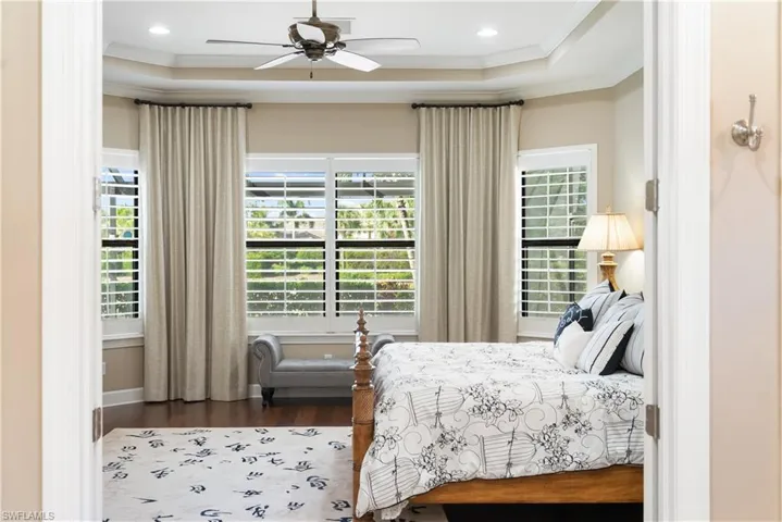 Wood-finish flooring, recessed lighting, and a ceiling fan