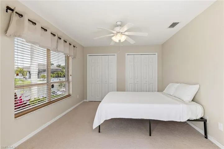 3rd guest bedroom with access to lanai and pool area