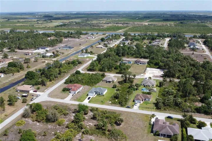 Drone / aerial view with a residential view and a water view