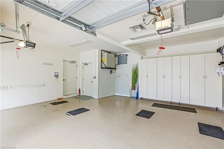 Garage featuring a garage door opener