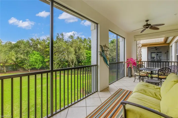 Sunroom / solarium with view of scattered trees