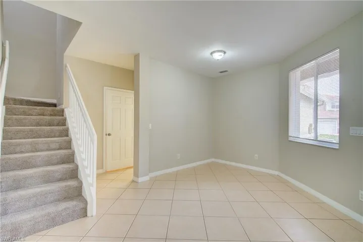 Spare room with light tile patterned floors