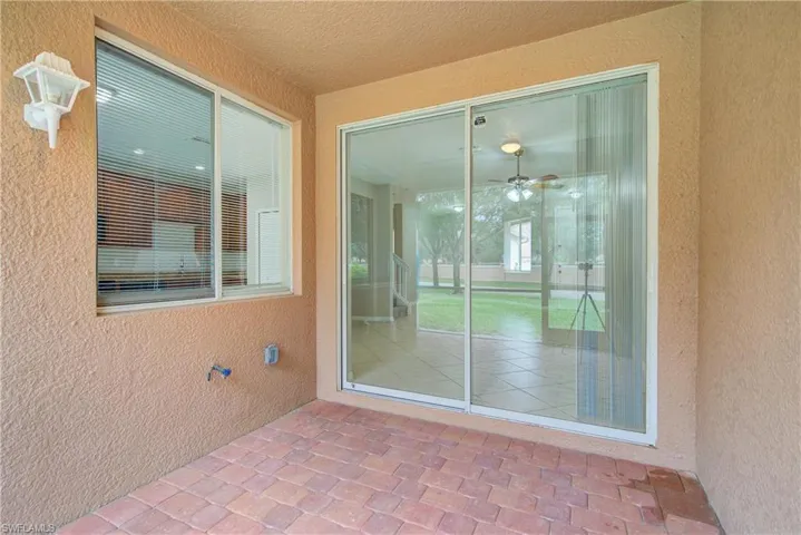 Property entrance featuring a patio area