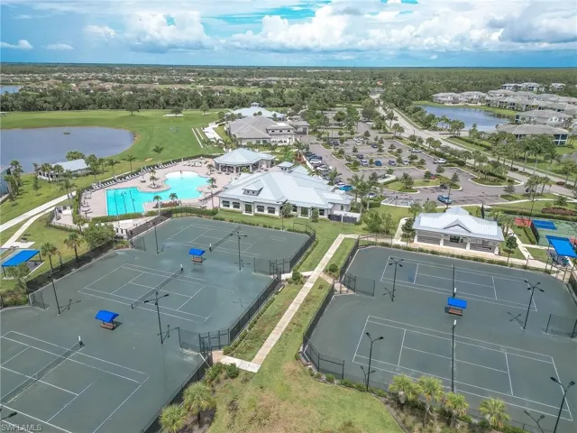 Aerial view of a pool and a large body of water