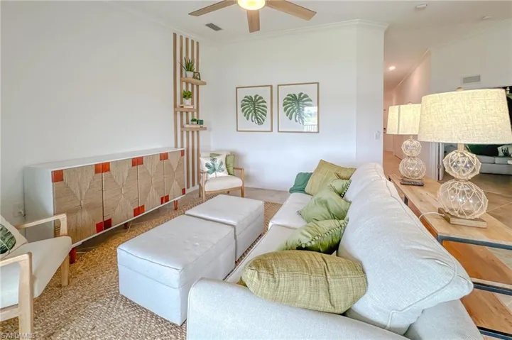 Living room featuring crown molding