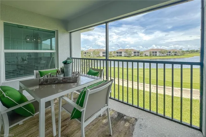Sunroom / solarium with a water view