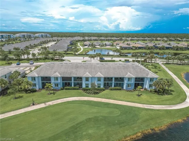 Aerial perspective of suburban area with a large body of water