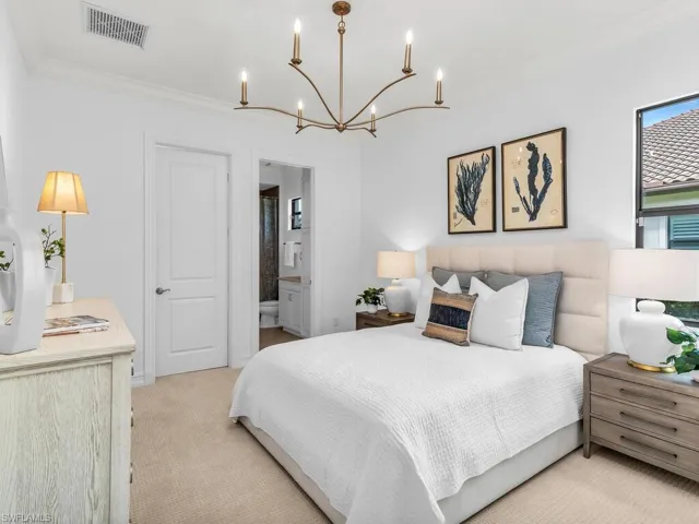 Bedroom with en suite bathroom and walk-in closet.