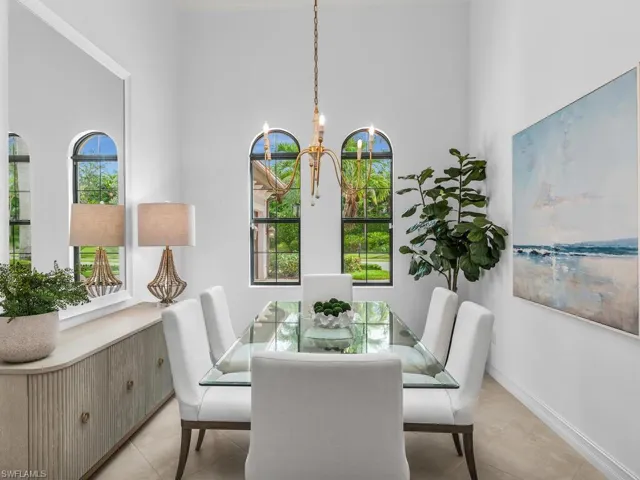 Dining room has natural light and custom coffered ceiling.