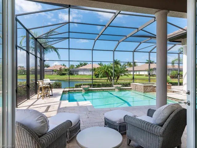 French doors open from primary bedroom directly to pool deck.