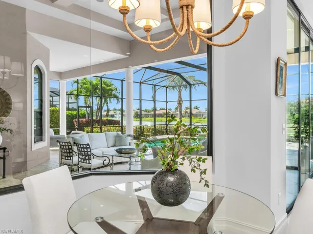 Bay window with pool and lake views.