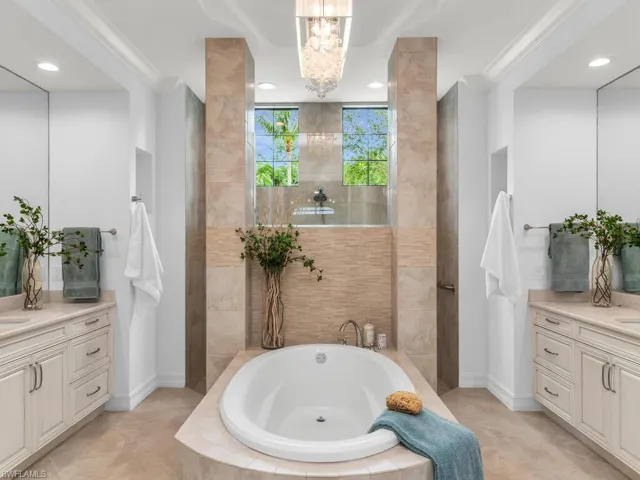 Spacious double vanity with soaking tub.