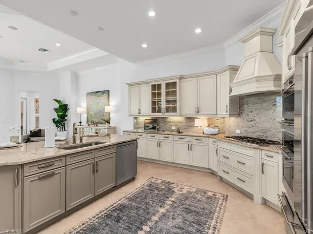 Kitchen with stainless steel appliances and gas range.