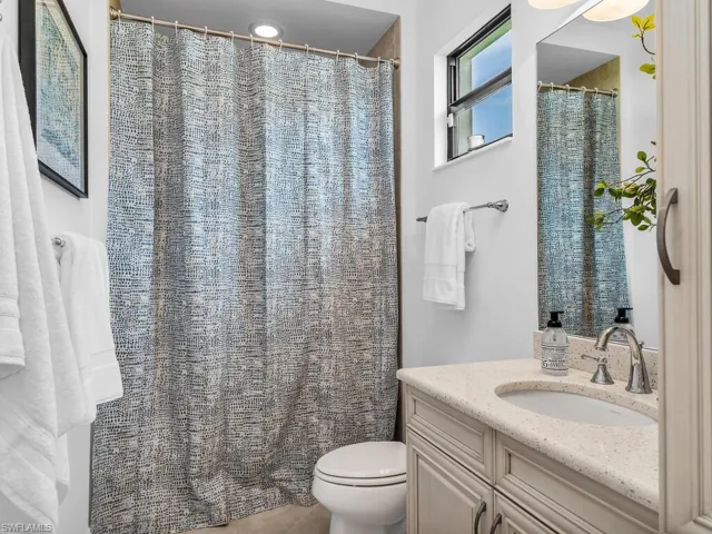 Full bathroom with shower / tub combo.
