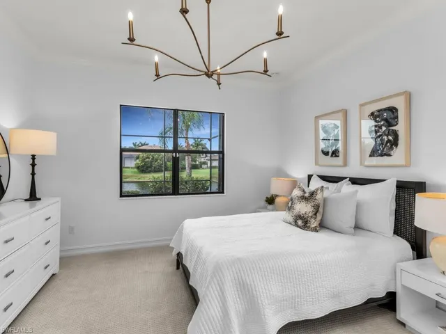 Bedroom with walk-in closet and hallway bathroom.
