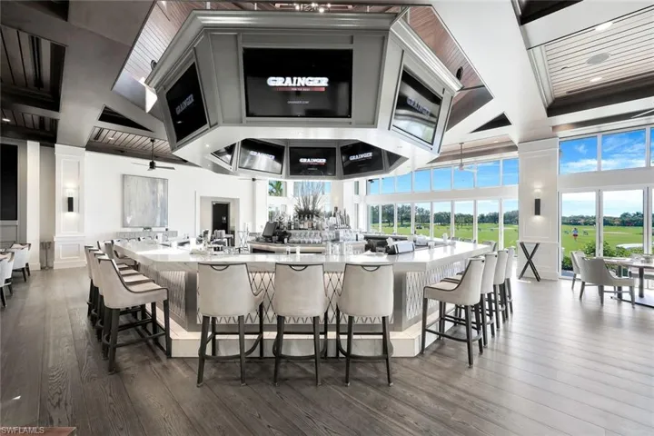 The Golfside Grill is a 9,000 square foot indoor- outdoor casual dining venue that features a folding glass door system for all-weather enjoyment of expansive sunset and golf course views.