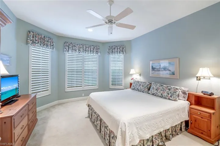 Front Guest Bedroom with plantation Shutters and King Size Bed