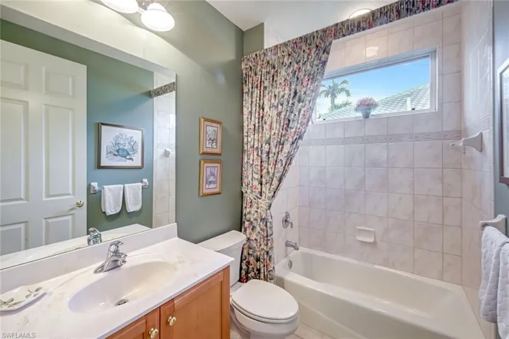 Full Guest Bathroom with shower / tub combo and Transom window for exceptional lighting