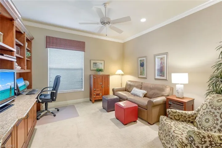 Large Office with custom built-in desk and Crown Molding