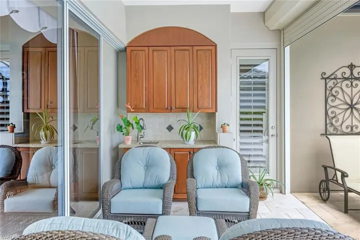 Covered Lanai with Custom Wet-Bar and Door to the Primary Bedroom