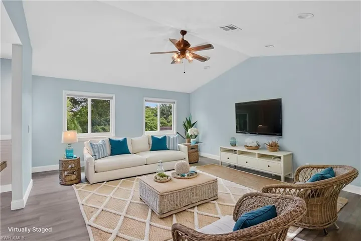 Vaulted ceilings with recessed lighting and ceiling fan