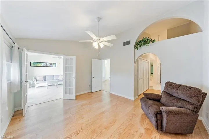 Master bedroom with French doors to the sunroom