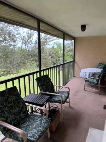 Sunroom featuring a balcony