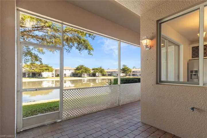 Unfurnished sunroom with a water view