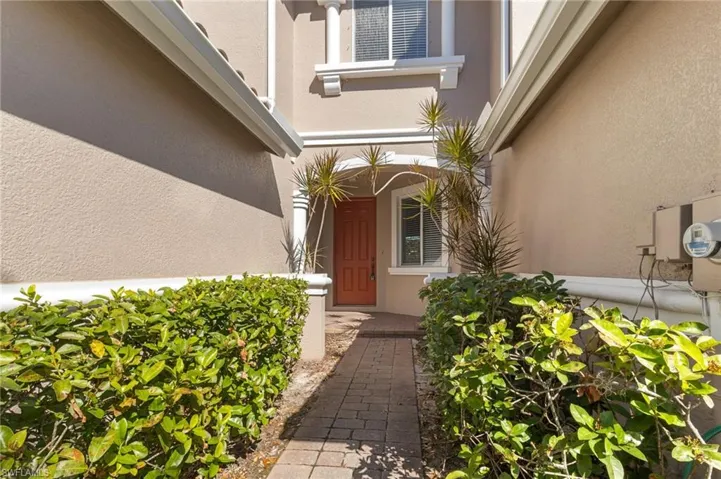 Entrance to property with stucco siding