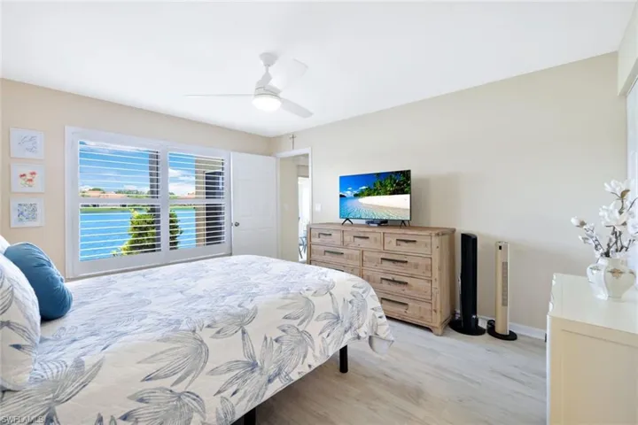 Bedroom featuring ceiling fan and light hardwood / wood-style floors