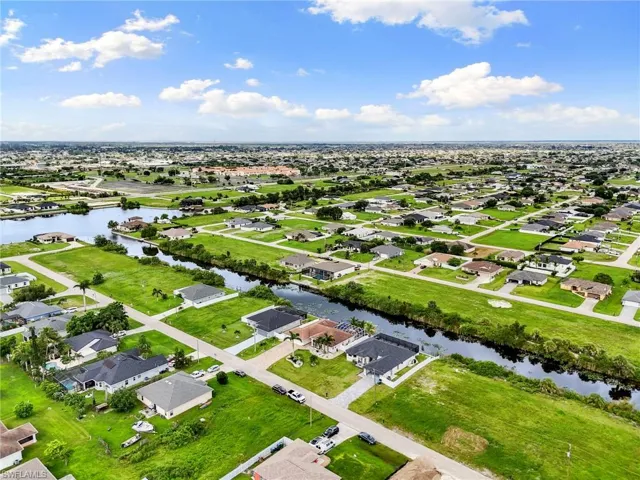 Aerial perspective of suburban area with a nearby body of water