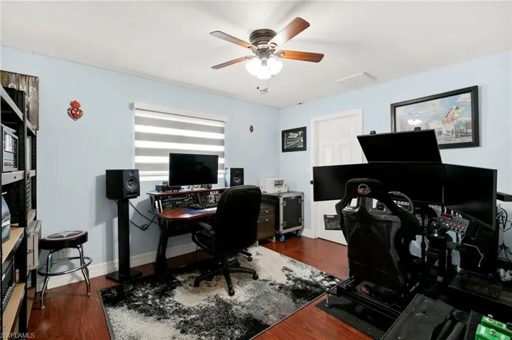 Office space featuring ceiling fan and wood finished floors