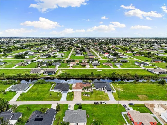 Aerial view of residential area with a large body of water