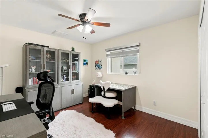 Office featuring wood finished floors and ceiling fan