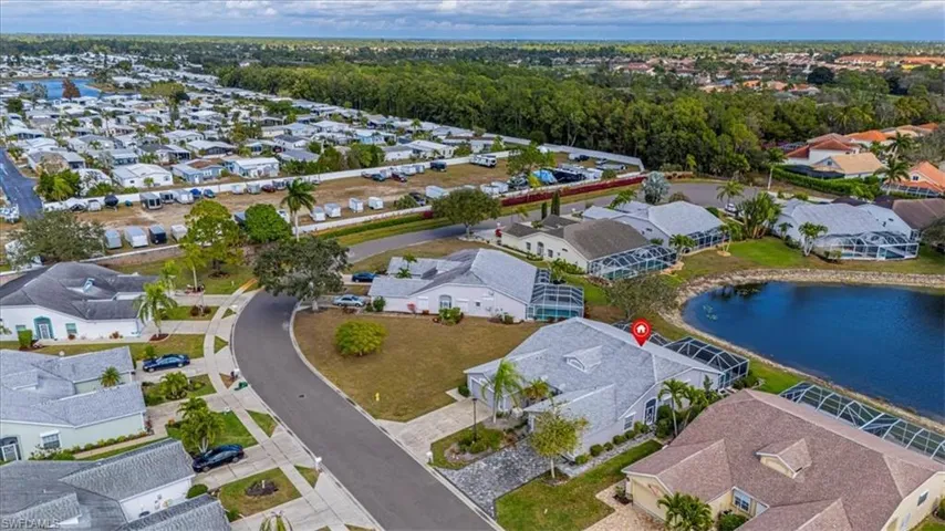 Aerial view of residential area with a large body of water.