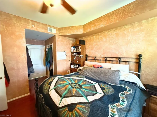 Bedroom with wood finished floors and a ceiling fan
