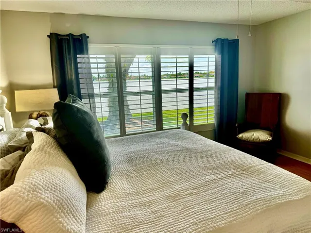 Bedroom with a textured ceiling