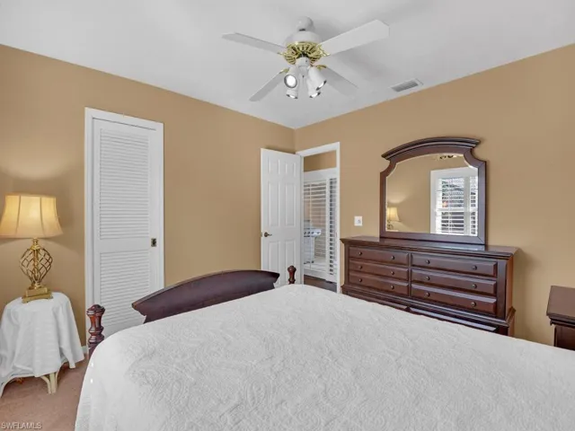Bedroom with a closet and ceiling fan